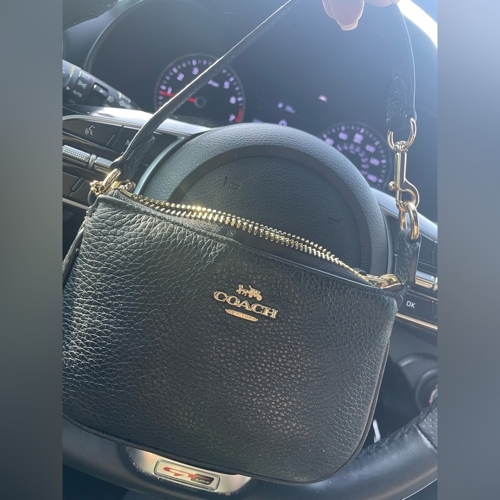 Coach wristlet black and gold